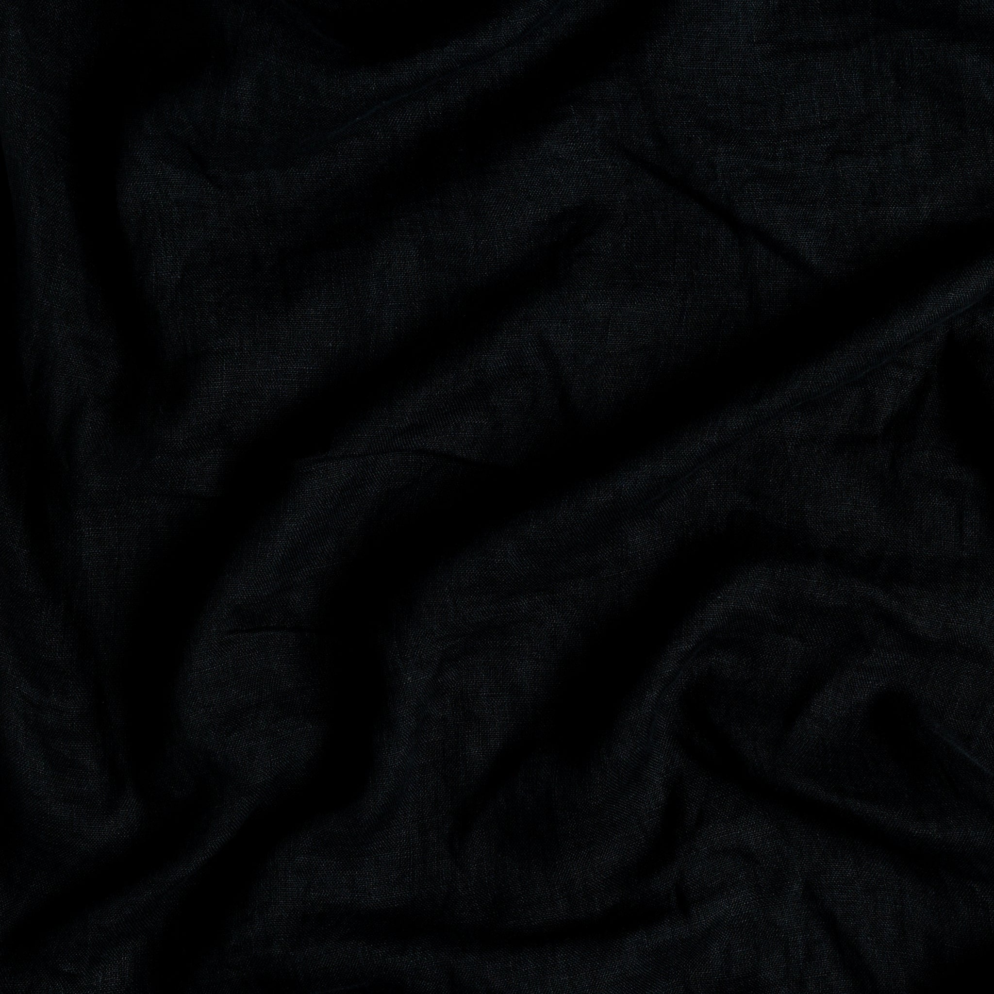 Linen Whisper Duvet Cover | Corvino | A close up of linen whisper, our lightweight linen gauze, in corvino, a black tone.