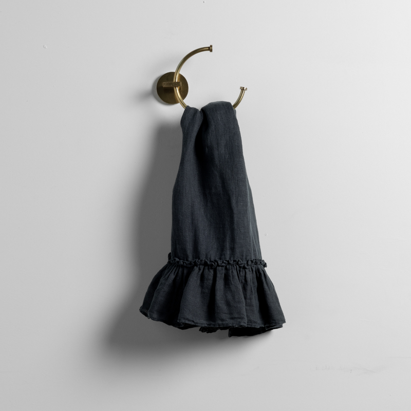 Linen Whisper Guest Towel | Slate | whisperweight linen guest towel on a decorative towel ring against a plain white background.