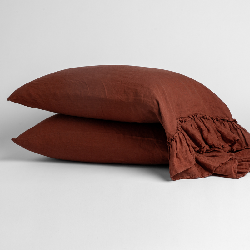 Linen Whisper Pillowcase (Single) | Autumn | A pair of Linen Whisper pillowcases in Autumn, a rich terracotta tone, shown against a white background.