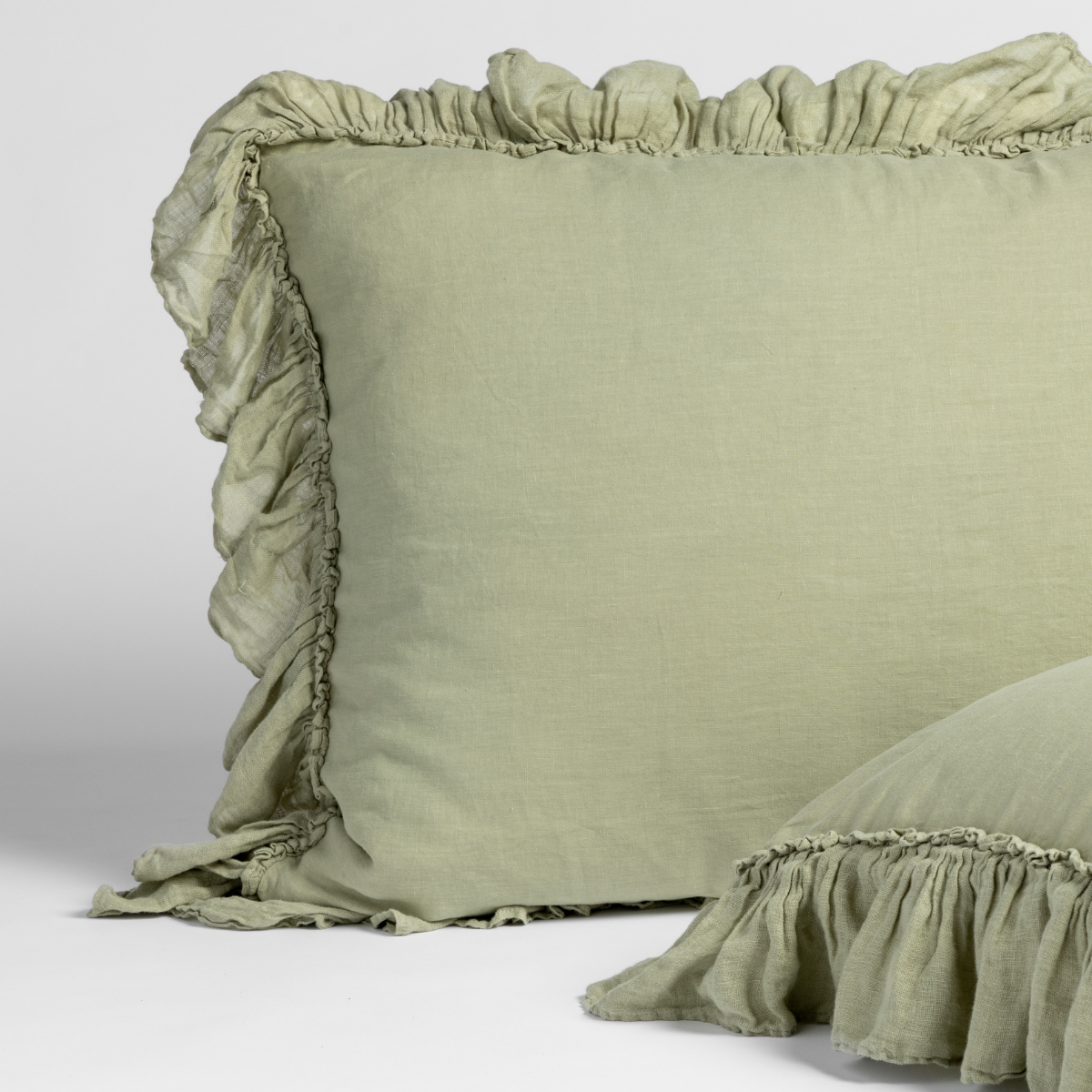 Linen Whisper Sham | Desert Sage | matching shams in desert sage, a serenely elegant green, offering a hushed hue, shown against a plain background.