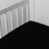 Madera Luxe Crib Sheet | Corvino | crib sheet shown on a mattress shown from overhead into the corner of a crib.