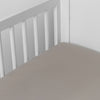 Madera Luxe Crib Sheet | Fog | crib sheet shown on a mattress shown from overhead into the corner of a crib.