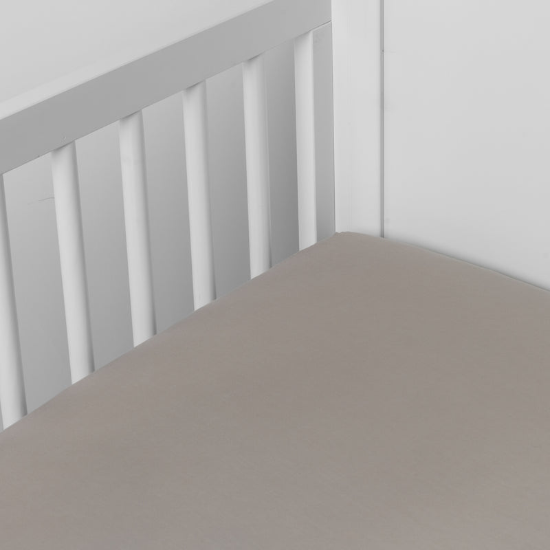 Madera Luxe Crib Sheet | Fog | crib sheet shown on a mattress shown from overhead into the corner of a crib.
