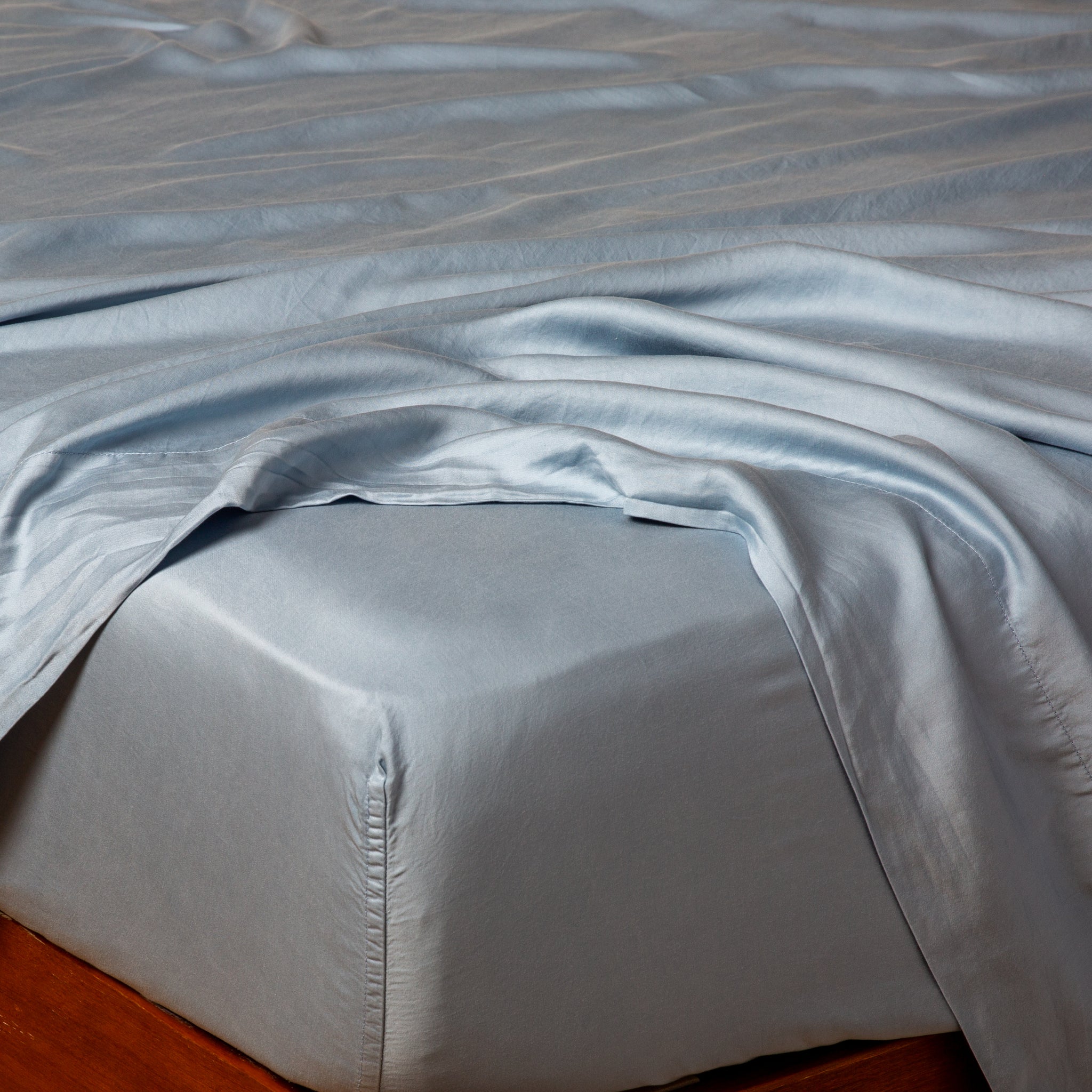 Madera Luxe Fitted Sheet | Tahoe Blue | tencel™ fitted sheet on a mattress with a matching flat sheet.