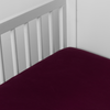 Madera Luxe Crib Sheet | Fig | crib sheet shown on a mattress shown from overhead into the corner of a crib.