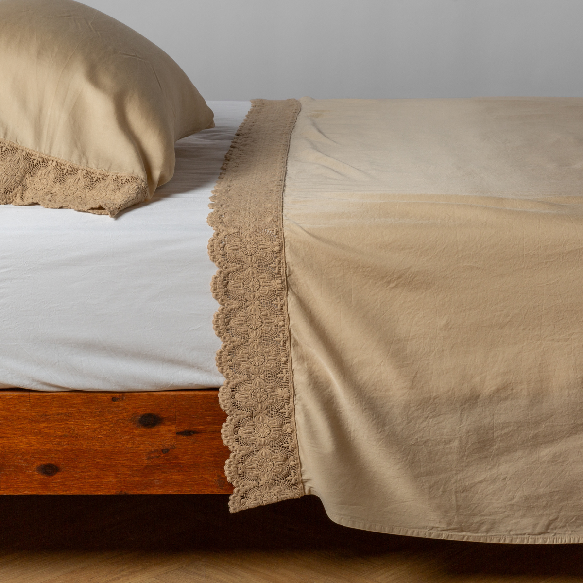 Madera Luxe Flat Sheet | Honeycomb | matching tencel flat sheet and pillowcase with cotton lace trim on a bed shown from the side