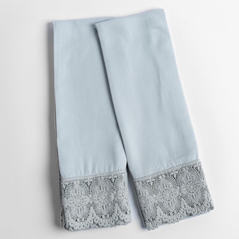 Madera Luxe Pillowcase (Single) | Cloud | a pair of tencel pillowcases trimmed with cotton lace shown overhead against a white background.