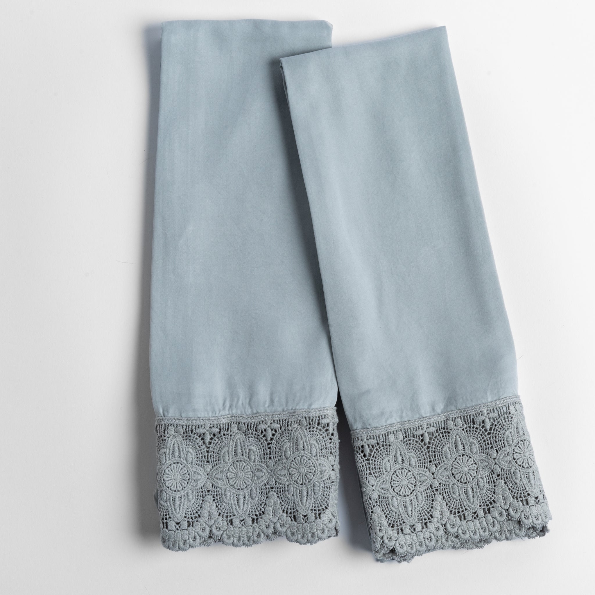 Madera Luxe Pillowcase (Single) | Mineral | a pair of tencel pillowcases trimmed with cotton lace shown overhead against a white background.