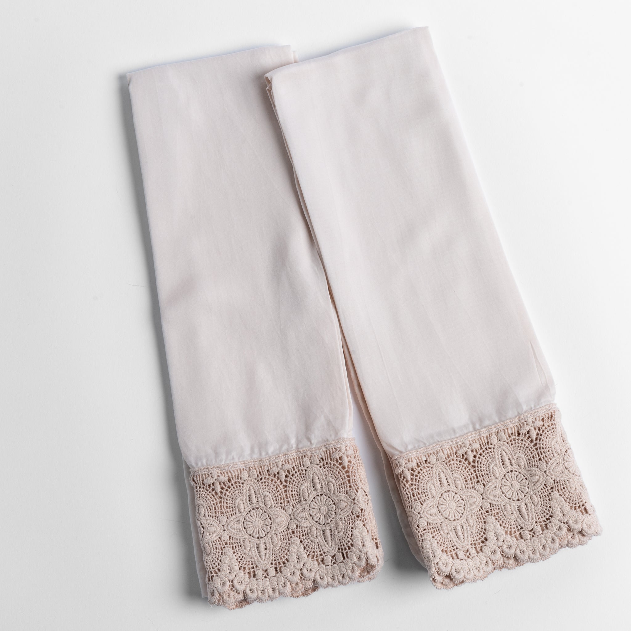 Madera Luxe Pillowcase (Single) | Pearl | a pair of tencel pillowcases trimmed with cotton lace shown overhead against a white background.