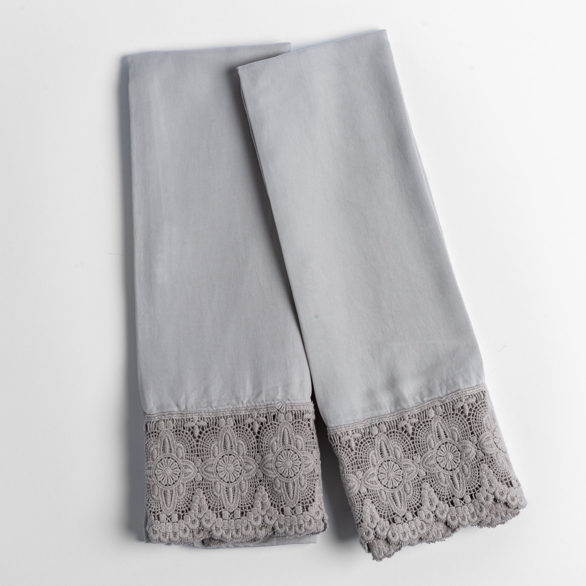 Madera Luxe Pillowcase (Single) | Fog | a pair of tencel pillowcases trimmed with cotton lace shown overhead against a white background.