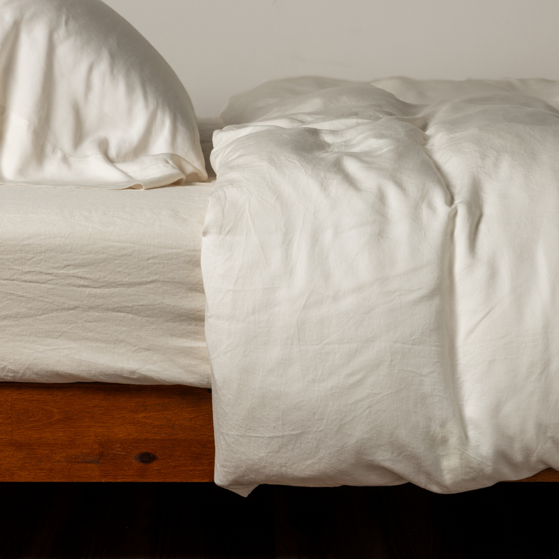 Madera Luxe Twin Duvet Cover | Natural | side view of a duvet cover with matching fitted sheet and pillowcase.