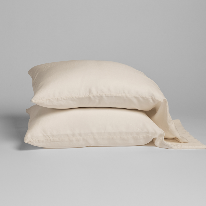 Madera Luxe Pillowcase (Single) | Natural | a stacked pair of tencel pillowcases.