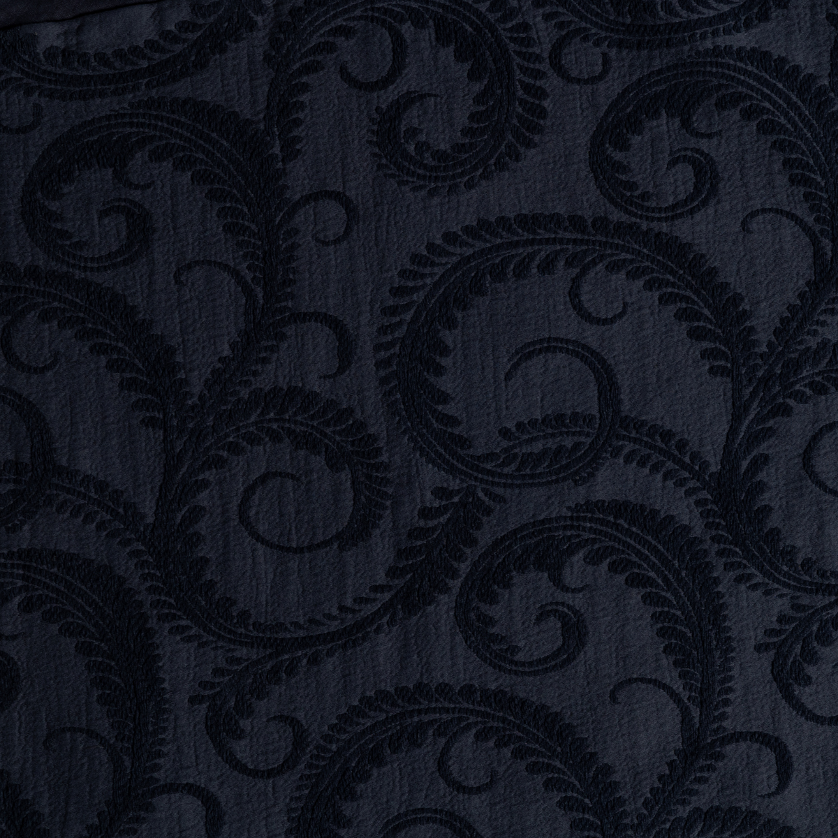 Marisette Bedspread | Slate | a close-up of organic cotton damask fabric in slate, a polished dusky dark blue
