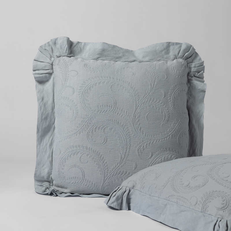 Marisette Sham | Cloud | a matching pair of organic cotton damask shams, one upright and one on its side shown against a white background.
