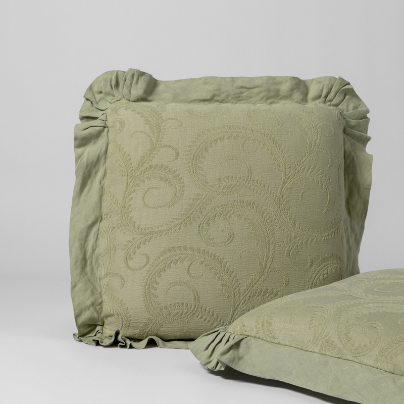 Marisette Sham | Desert Sage | matching shams in desert sage, a serenely elegant green, offering a hushed hue, shown against a plain background.