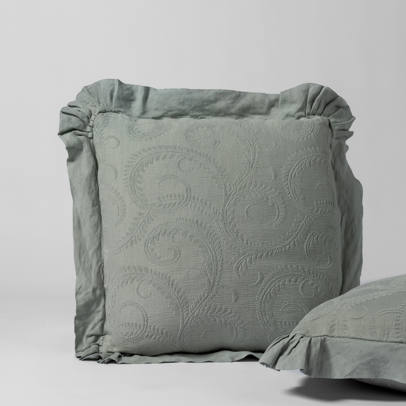 Marisette Sham | Eucalyptus | a matching pair of organic cotton damask shams, one upright and one on its side shown against a white background.