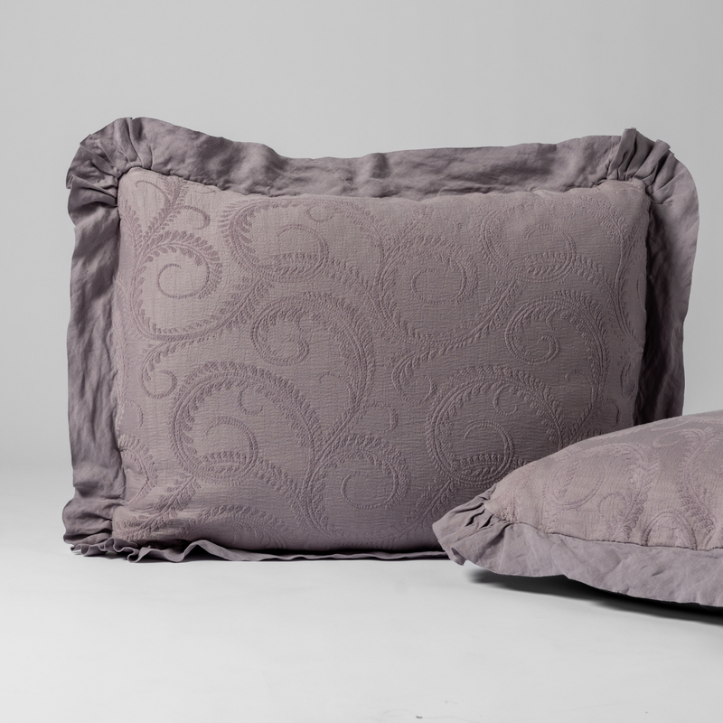 Marisette Sham | French Lavender | a matching pair of organic cotton damask shams, one upright and one on its side shown against a white background.