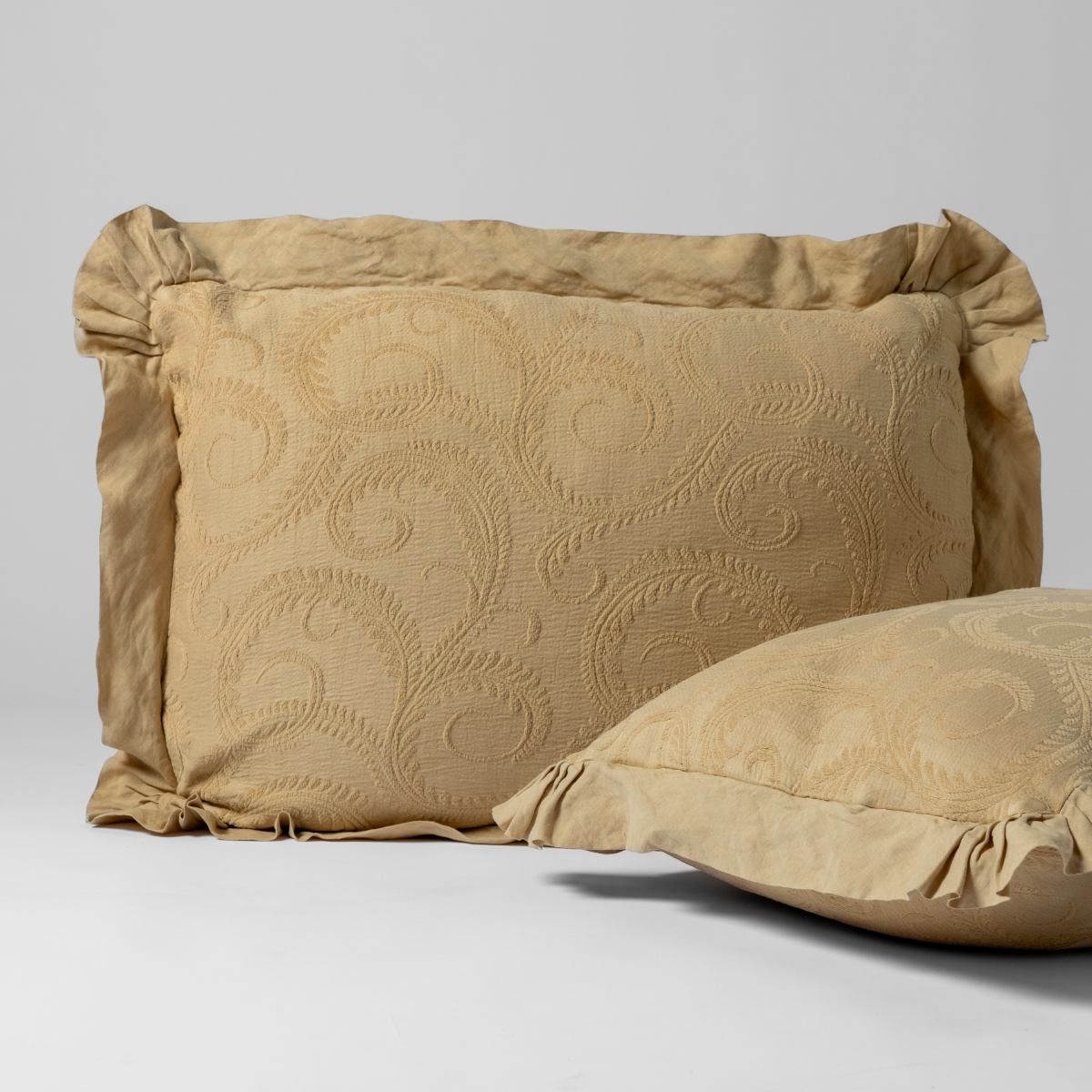 Marisette Sham | Honeycomb | a matching pair of organic cotton damask shams, one upright and one on its side shown against a white background.