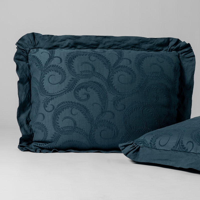 Marisette Sham | Midnight | a matching pair of organic cotton damask shams, one upright and one on its side shown against a white background.