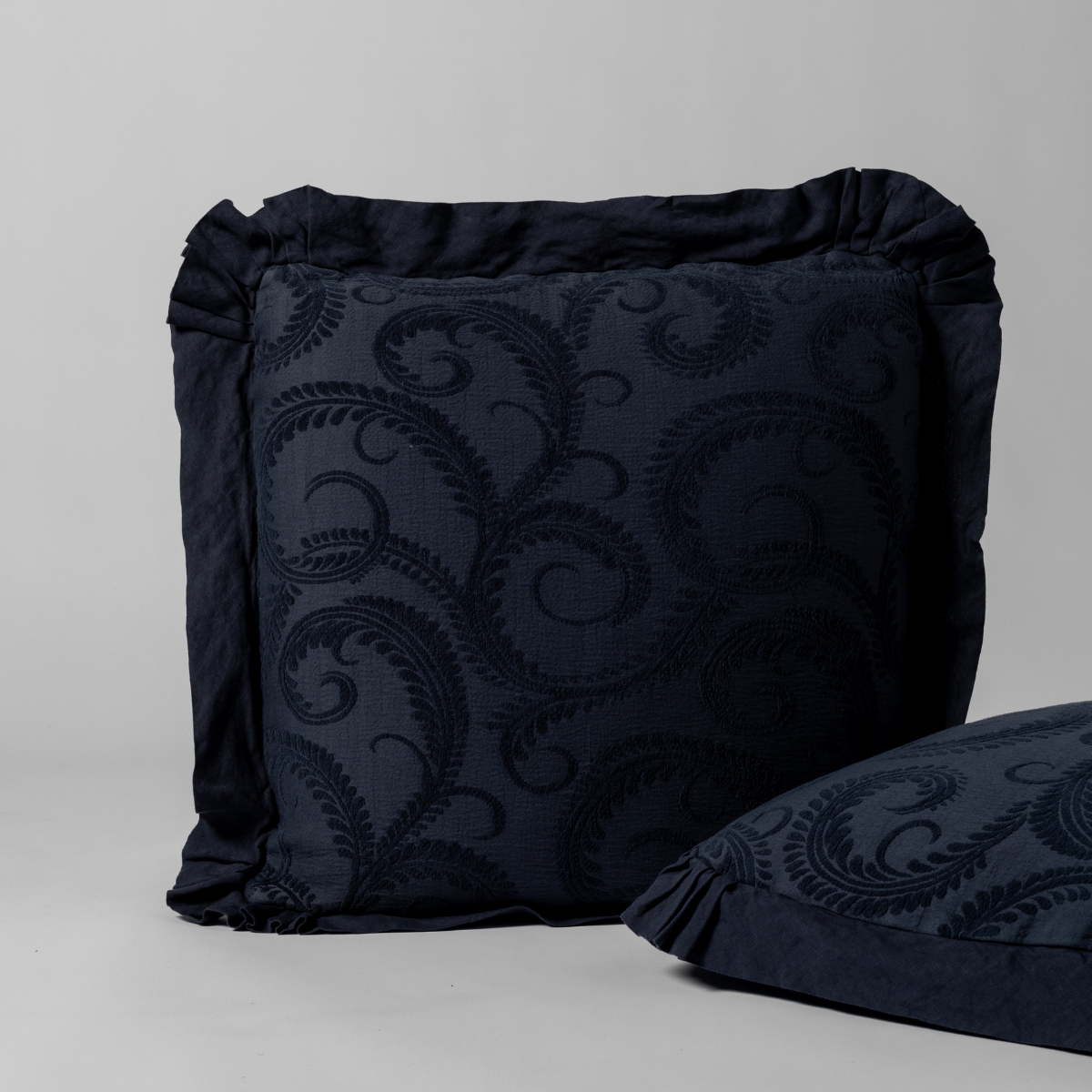 Marisette Sham | Slate | matching pair of Marisettte shams in slate, a polished dusky dark blue, shown against a white background.