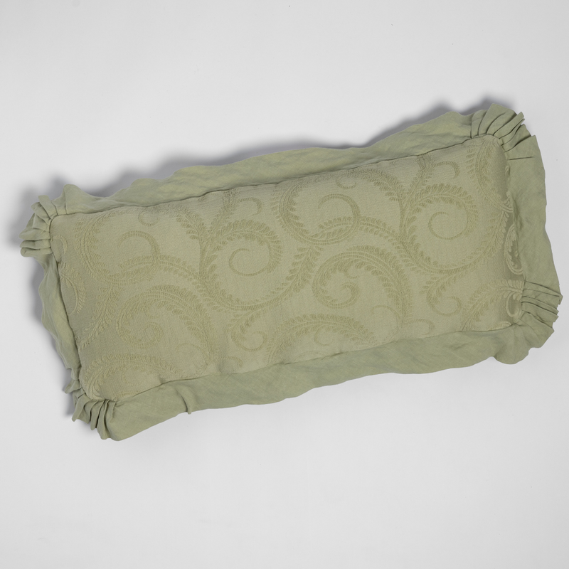 Marisette Throw Pillow | Desert Sage | shot from overhead, a throw pillow in desert sage, a serenely elegant green, offering a hushed hue, shown against a plain background.