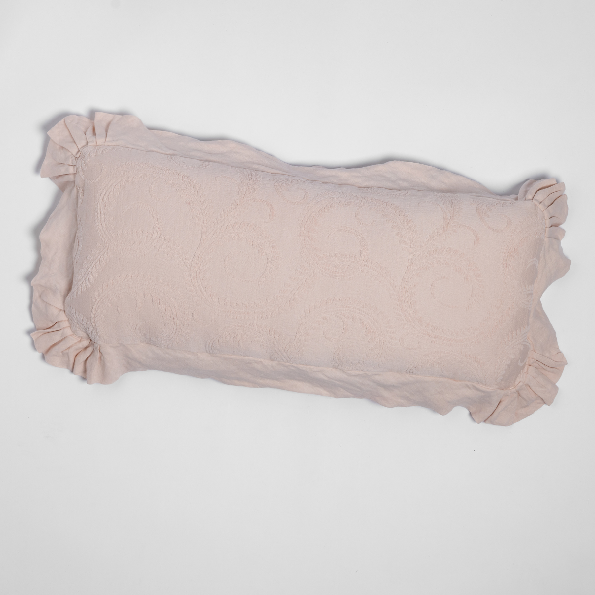 Marisette Throw Pillow | Pearl | an overhead shot of an organic cotton damask throw pillow against a white background.