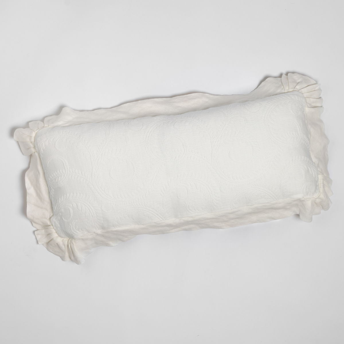 Marisette Throw Pillow | Winter White | an overhead shot of an organic cotton damask throw pillow against a white background.