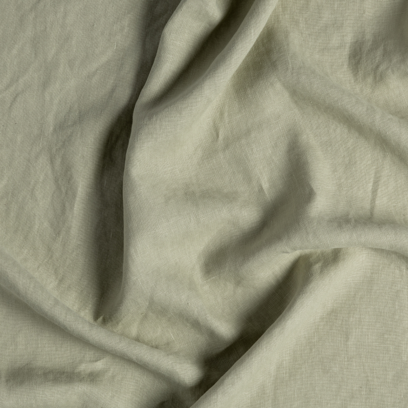 Austin Guest Towel | Desert Sage | close-up of midweight linen fabric gently rumpled in desert sage, a serenely elegant green, offering a hushed hue.