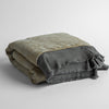 Mirabella Baby Bundle - Holiday Release | Moonlight | silk and tencel™ blend jacquard baby blanket folded and shot from a slight overhead angle to show the trim detail against a white background.