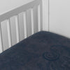 Mirabella Baby Bundle - Holiday Release | Midnight | silk and tencel™ blend jacquard crib sheet shot from above at a slight angle into the corner of a white crib.