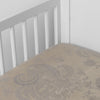 Mirabella Baby Bundle - Holiday Release | Moonlight | silk and tencel™ blend jacquard crib sheet shot from above at a slight angle into the corner of a white crib.