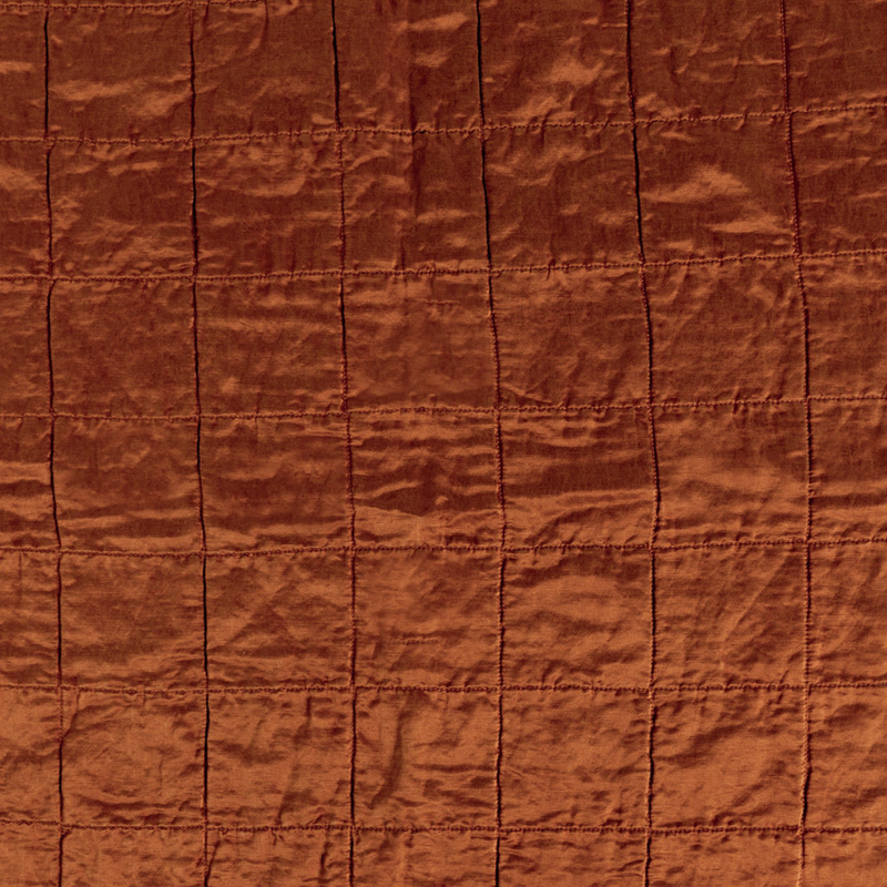Sel Sham | Autumn | A shot of square-quilted charmeuse in Autumn, a rich terracotta tone.
