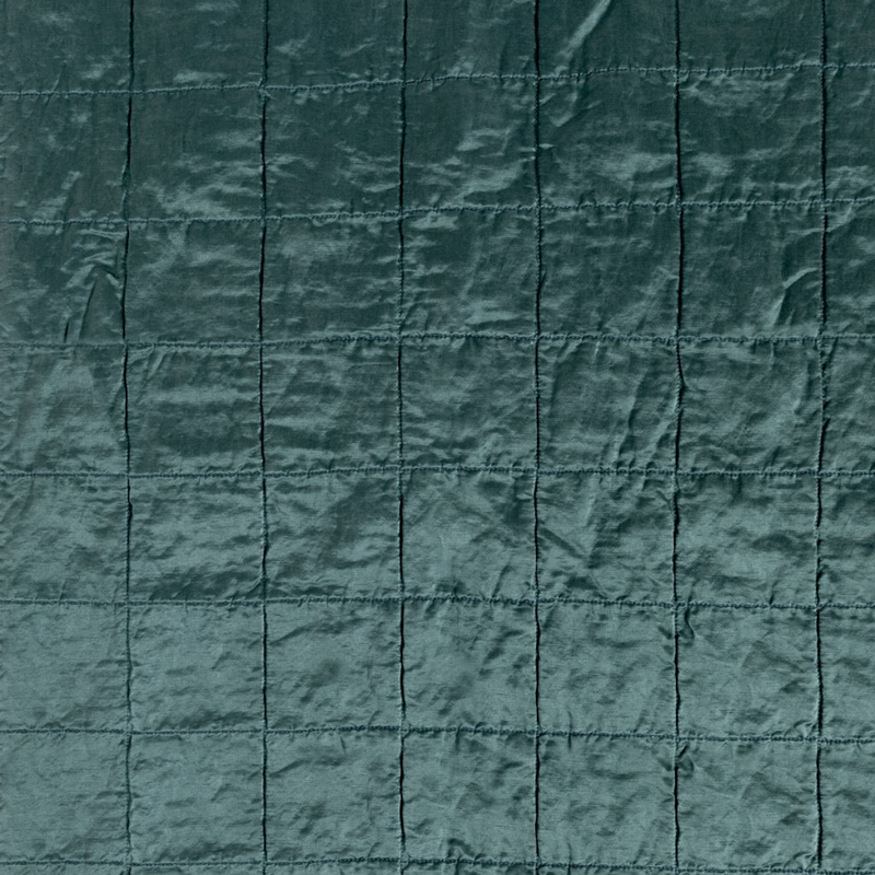 Sel Sham | Cenote | a shot of square-quilted charmeuse in cenote, a vibrant ocean-inspired blue-green.