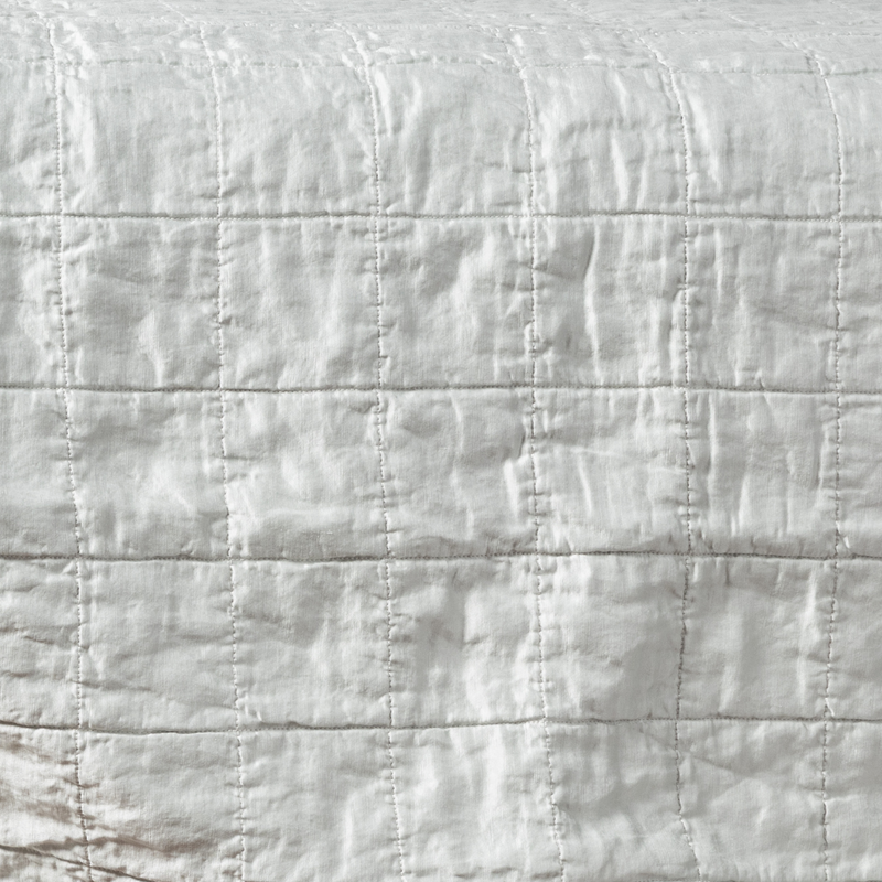 Sel Sham | Cloud | a shot of square-quilted charmeuse in cloud, a subtle sky blue-grey.