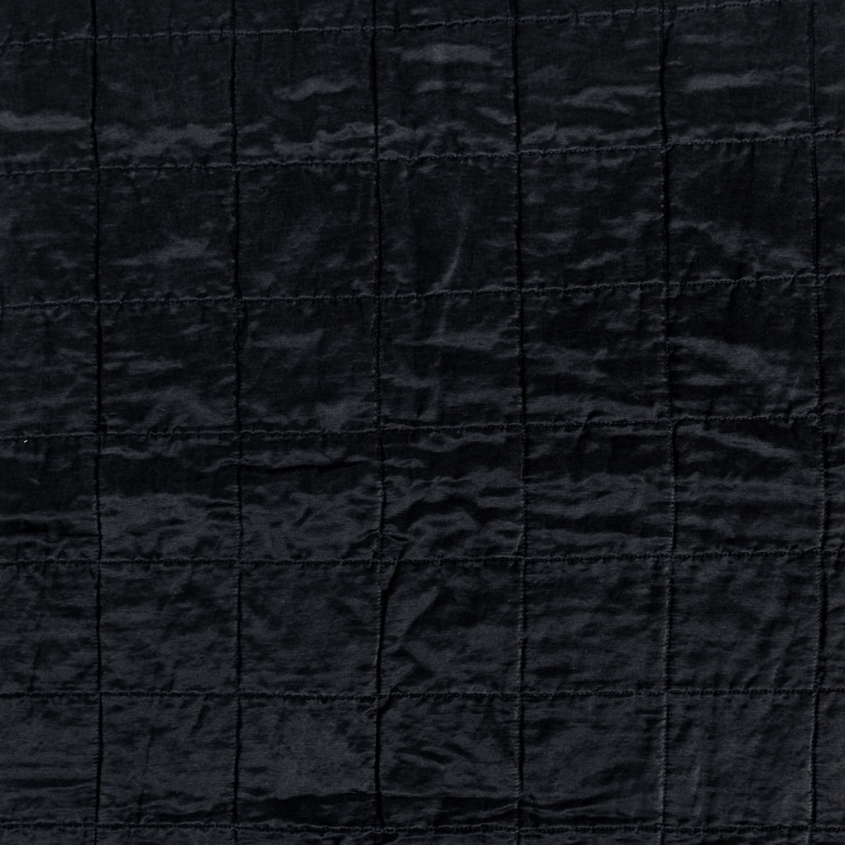 Sel Sham | Corvino | a shot of square-quilted charmeuse in corvino, our classic black.