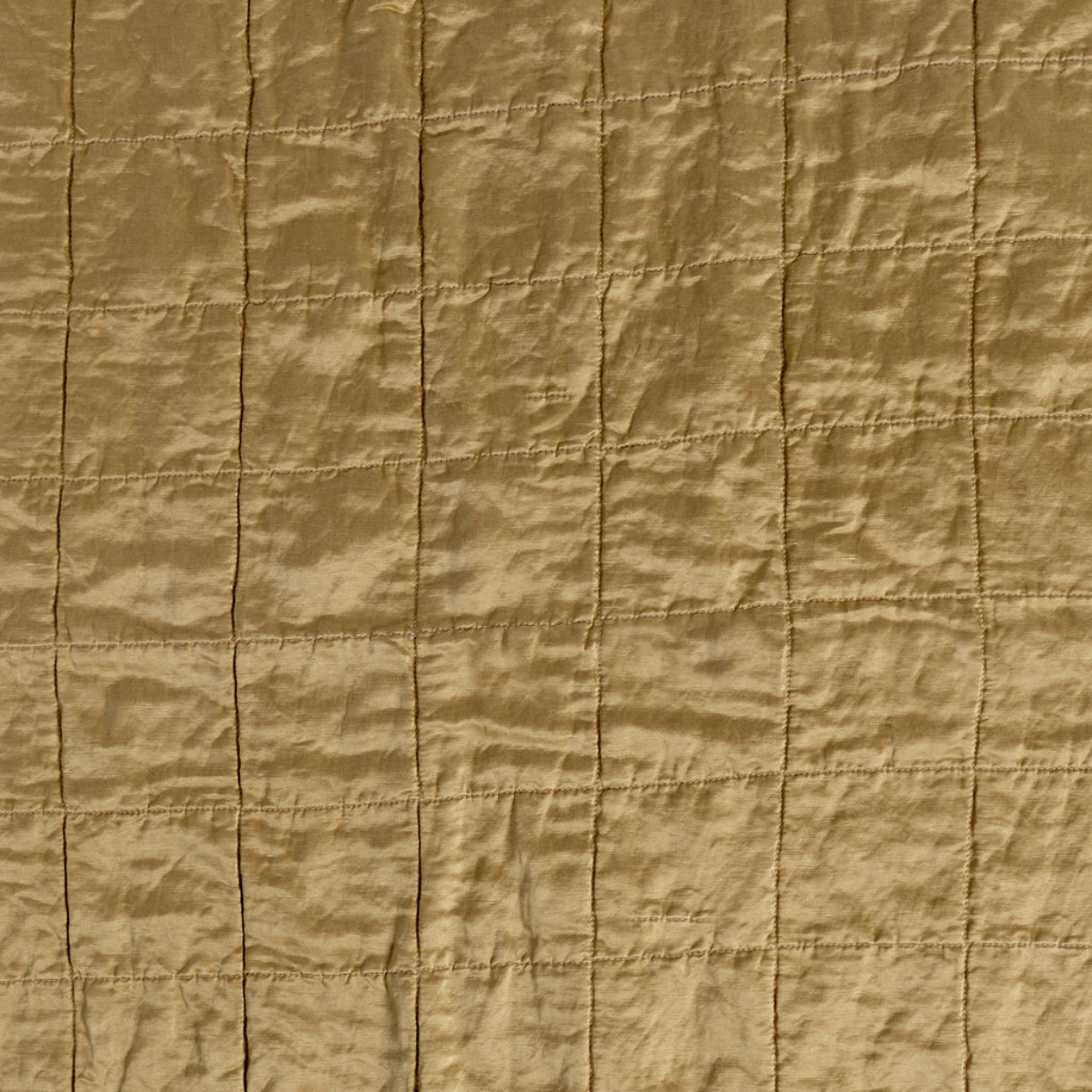 Sel Sham | Honeycomb | a shot of square-quilted charmeuse in honeycomb, a warm golden tone.