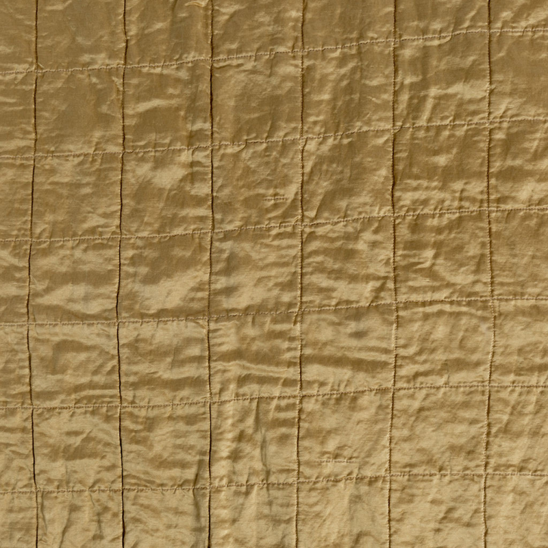 Sel Sham | Honeycomb | a shot of square-quilted charmeuse in honeycomb, a warm golden tone.