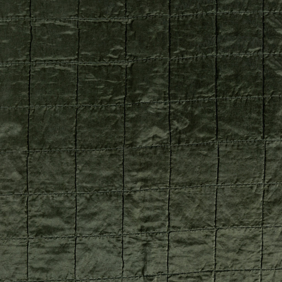 Sel Sham | Juniper | a shot of square-quilted charmeuse in juniper, a deeply saturated dark green.