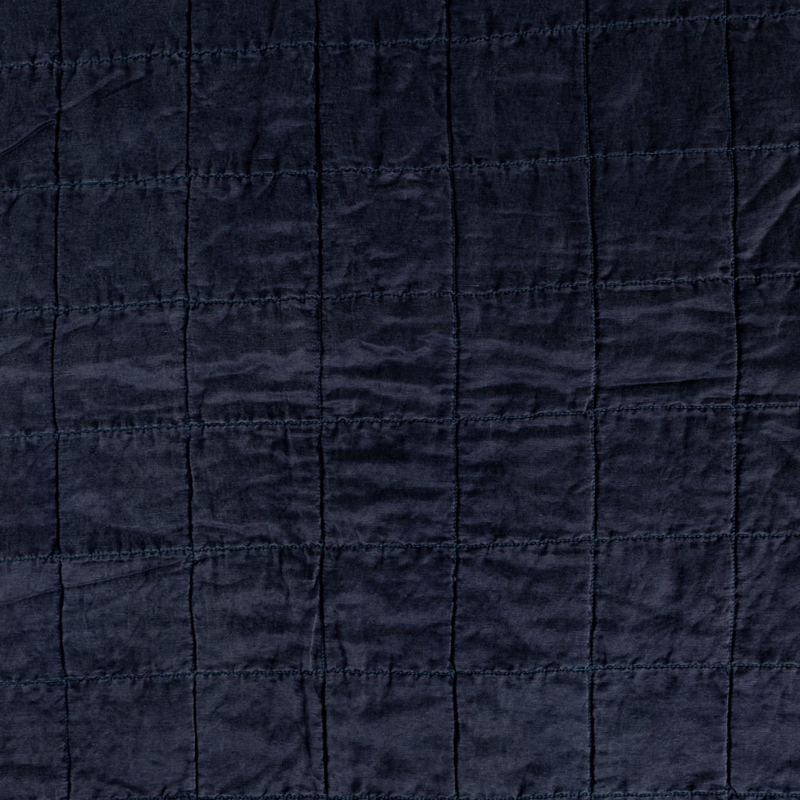 Sel Sham | Midnight | A shot of square-quilted charmeuse in midnight, a rich indigo tone.