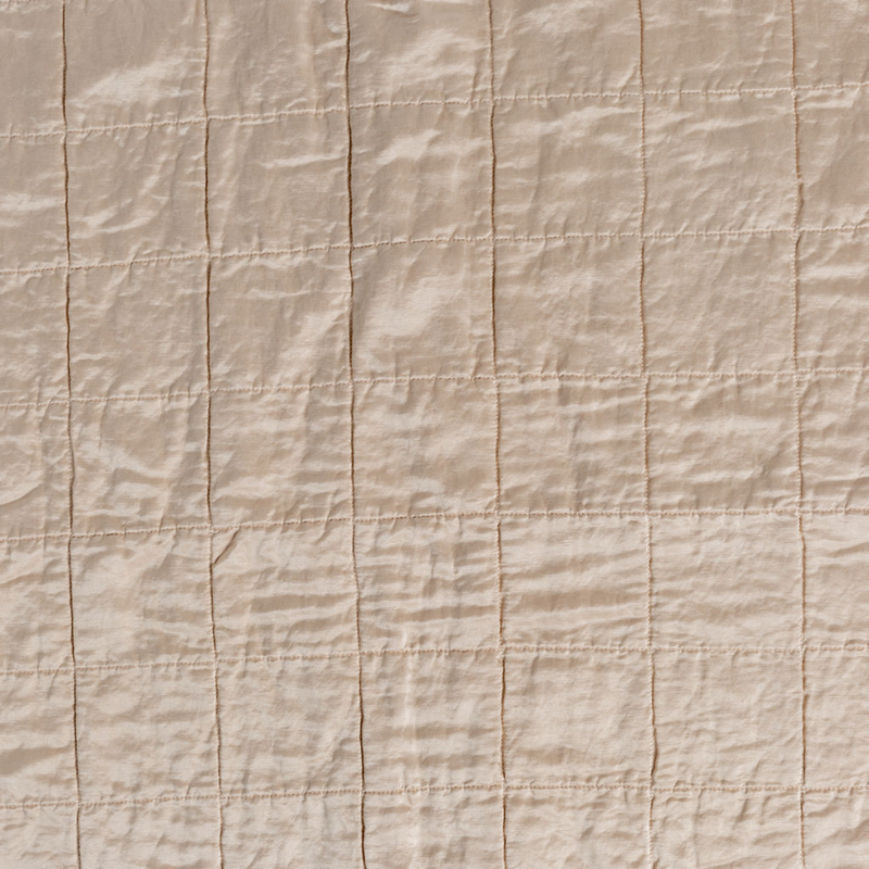 Sel Sham | Pearl | A shot of square-quilted charmeuse in pearl, a soft rose pink tone.