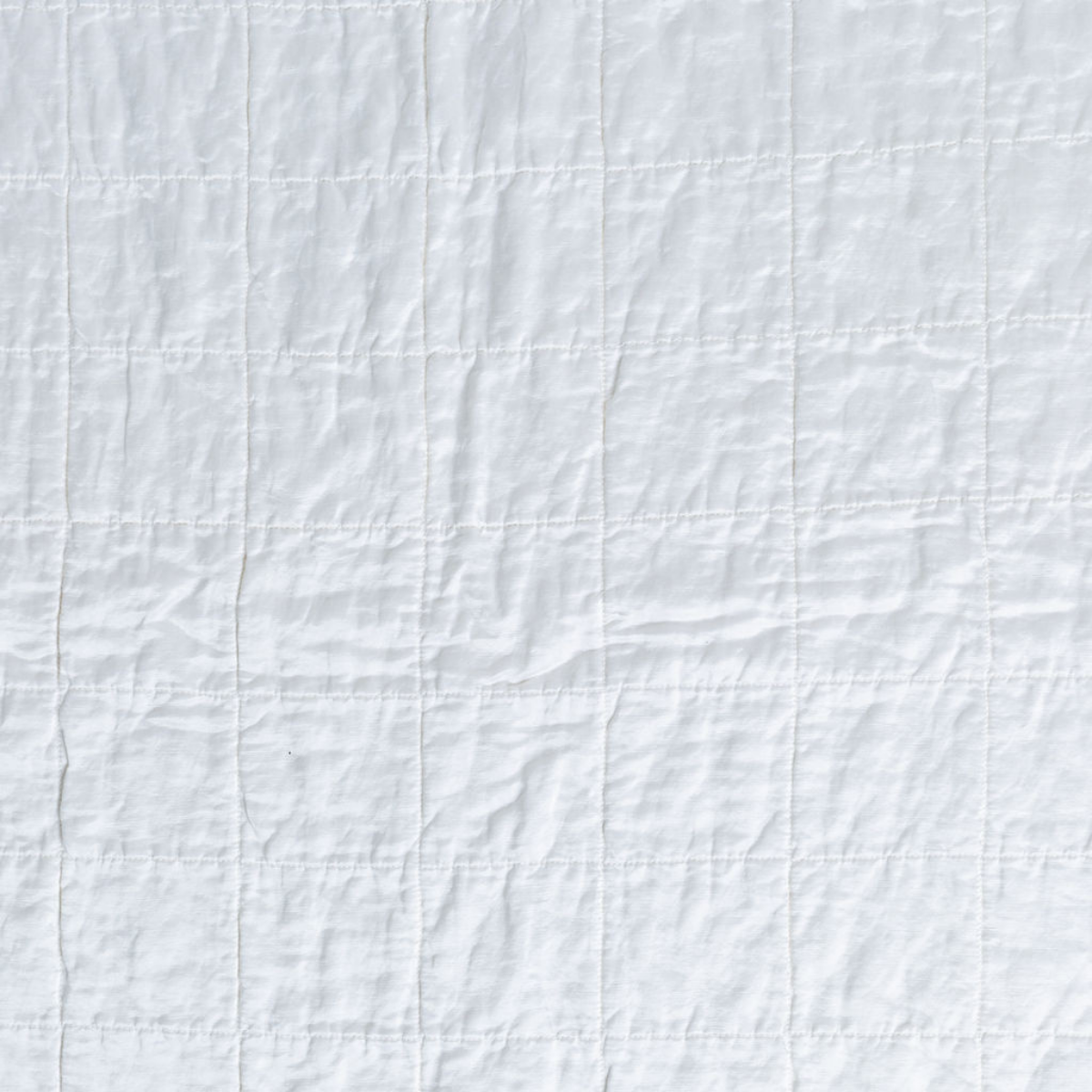 Sel Sham | White | a shot of square-quilted charmeuse in white.