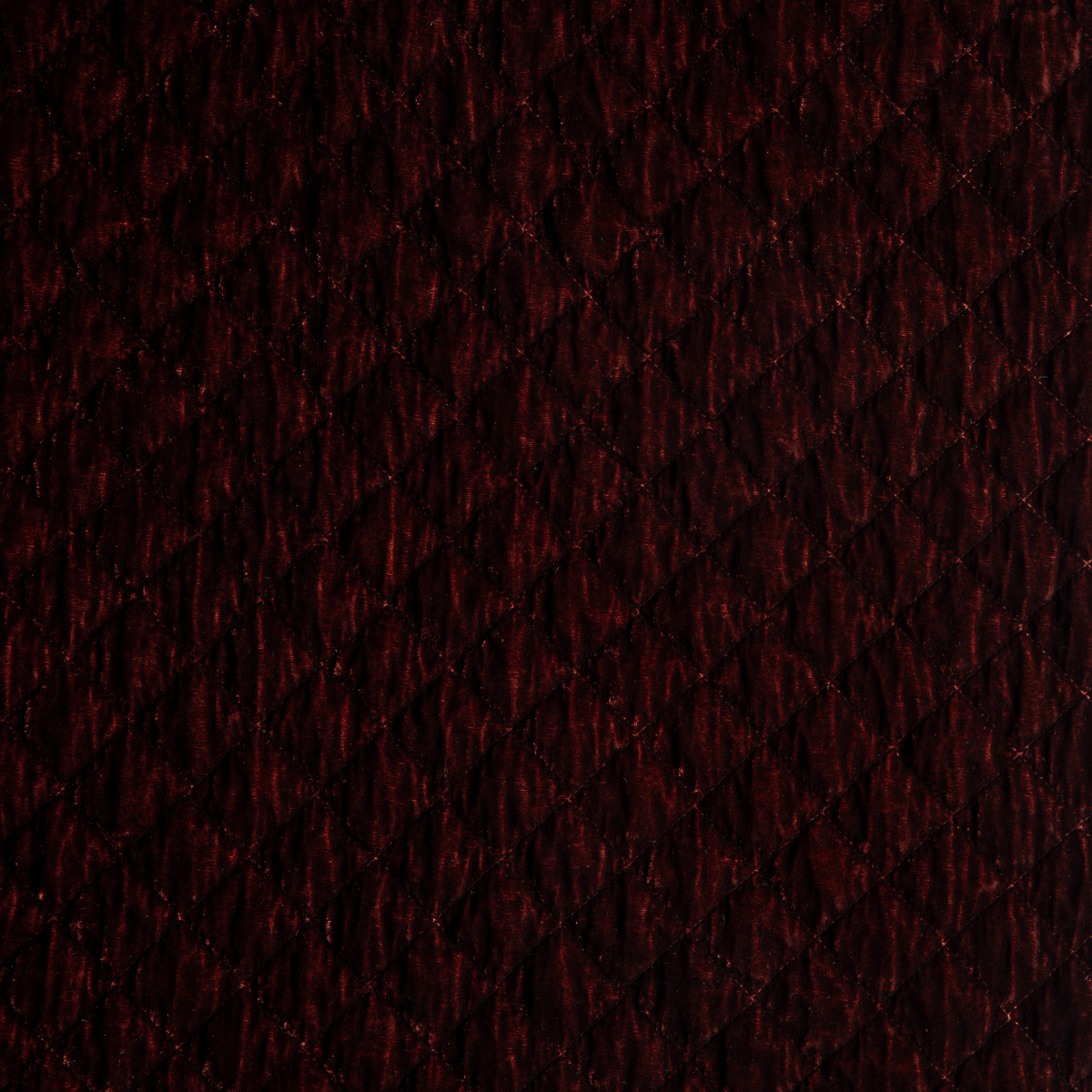 Silk Velvet Quilted Coverlet | Autumn | A close-up of Silk Velvet Quilted fabric in the colorway, Autumn, a rich terracotta tone.