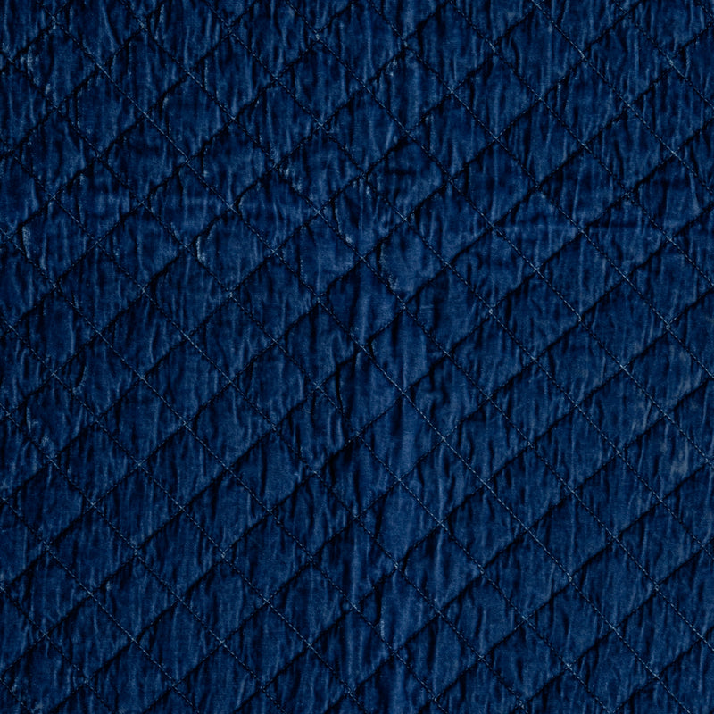 Silk Velvet Quilted Sham | Tahoe Blue | A close-up of silk velvet quilted fabric in the colorway, Tahoe Blue, a saturated blue like a crystal clear sky.