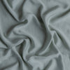 Madera Luxe Crib Sheet | Eucalyptus | A close up of Tencel™ fabric in eucalyptus, a soft light green.
