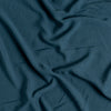 Madera Luxe Crib Sheet | Midnight | A close up of Tencel™ fabric in midnight, a rich indigo tone.