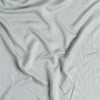 Madera Luxe Crib Sheet | Mineral | A close up of Tencel™ fabric in mineral, a soothing seafoam blue with subtle grey-green undertones.