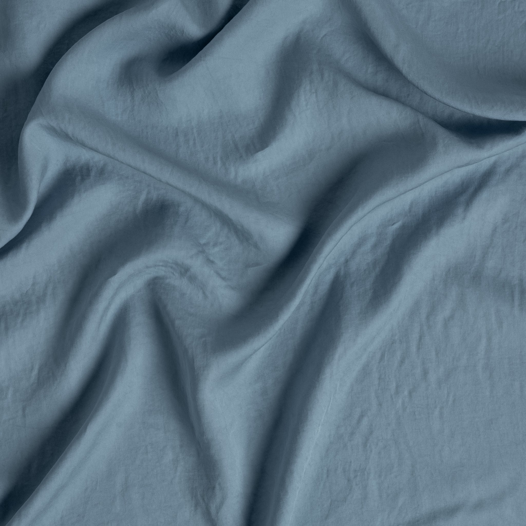 Tencel™ Swatch Card | Tahoe Blue | a close up of tencel™ fabric gently rumpled.