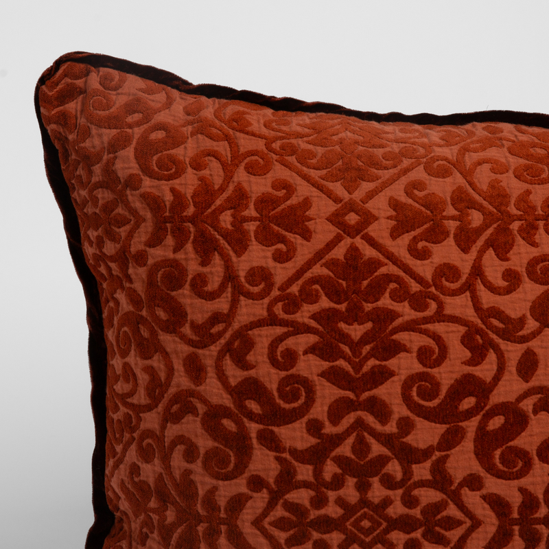 Vienna Sham | Autumn | A close-up of the corner of a Vienna Throw Pillow in Autumn, a rich terracotta tone, shown against a white background.