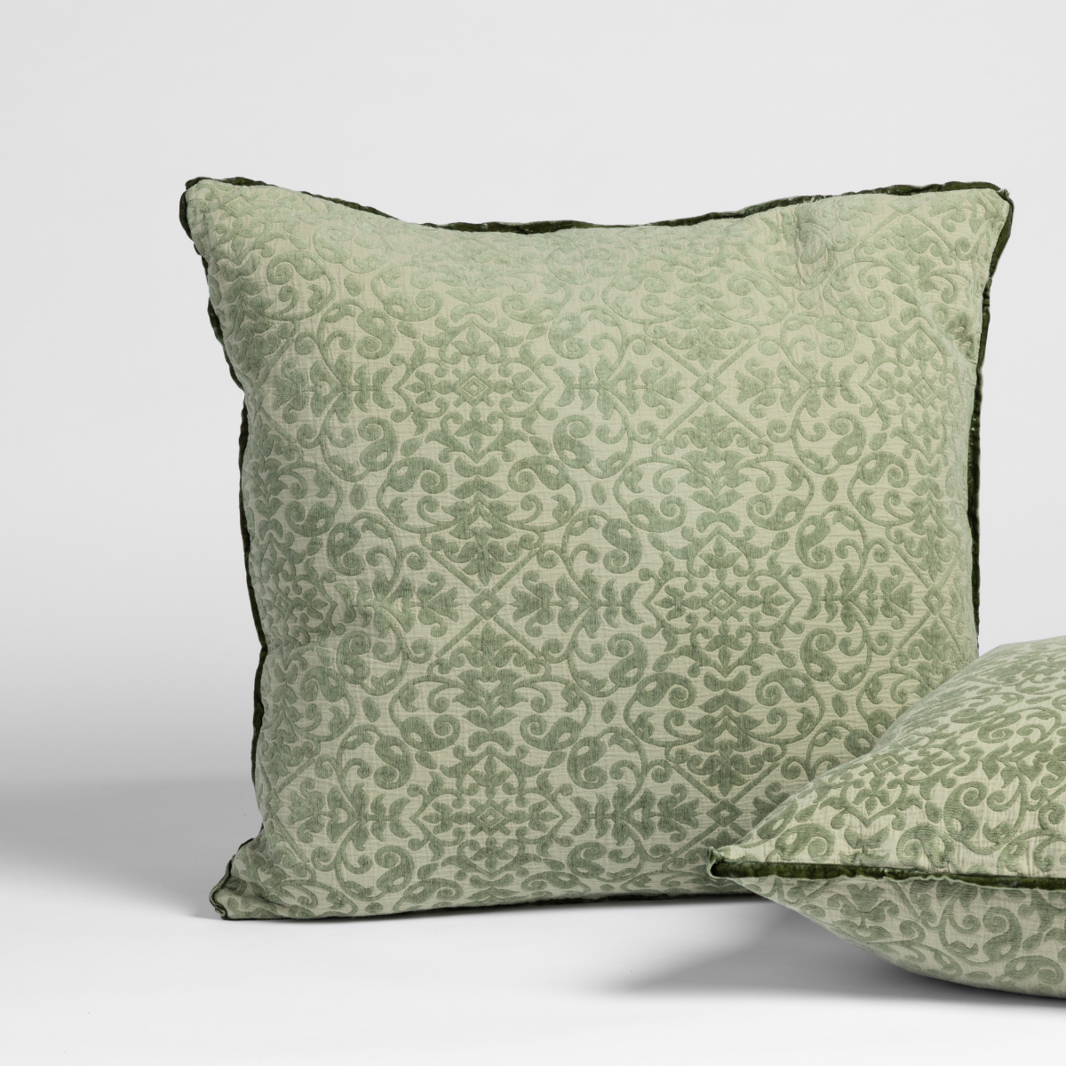 Vienna Sham | Desert Sage | matching shams in desert sage, a serenely elegant green, offering a hushed hue, shown against a plain background.