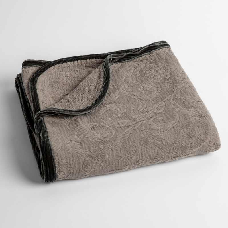 Adele Baby Blanket | Moonlight | a folded blanket with the corner turned down to show the trim against a white background, shot from an overhead angle.